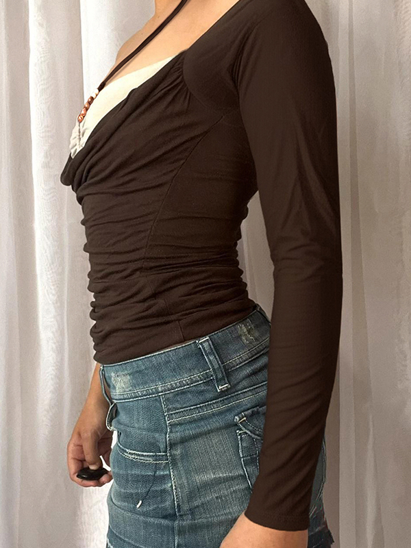 Tops de cuello redondo y manga larga con aberturas