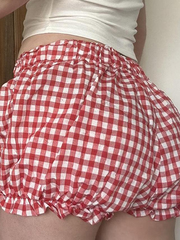 Pantalones cortos con estampado de cuadros y pajarita